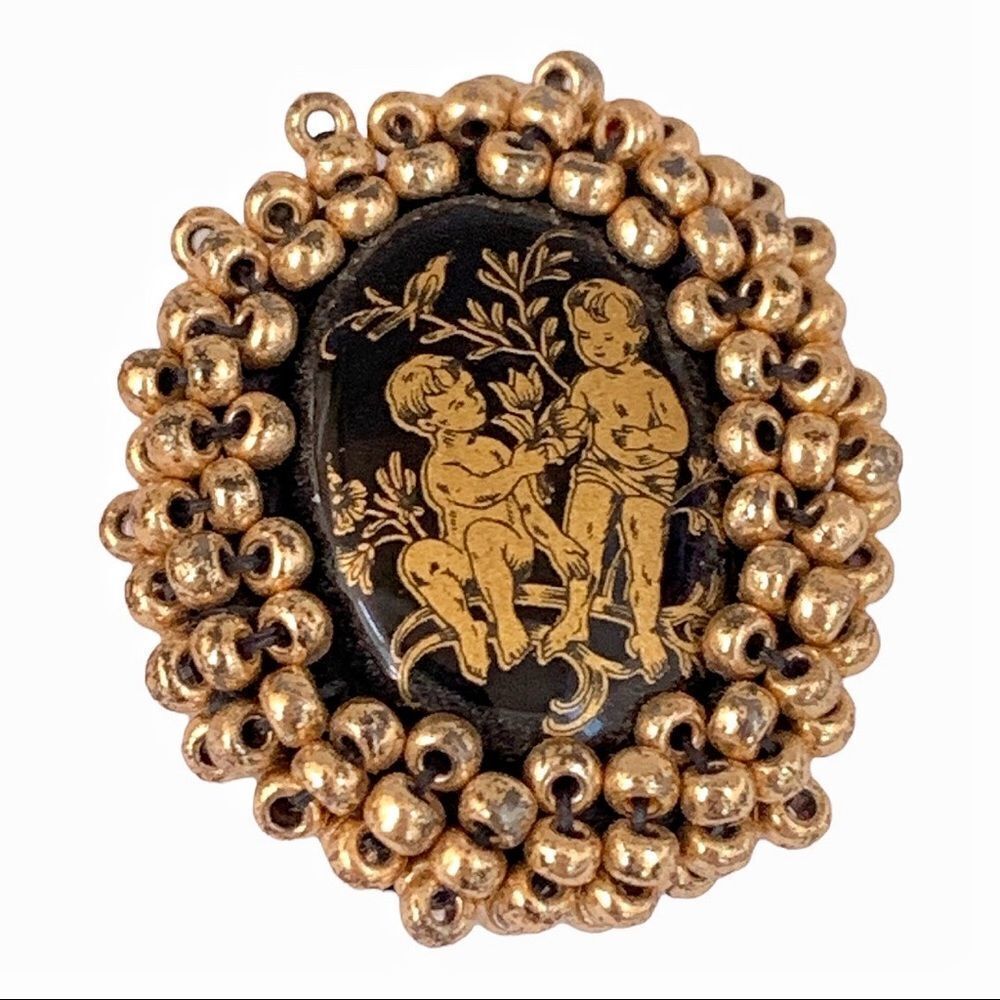 Vintage black glass gold cherub earrings with hand beaded gold bezel